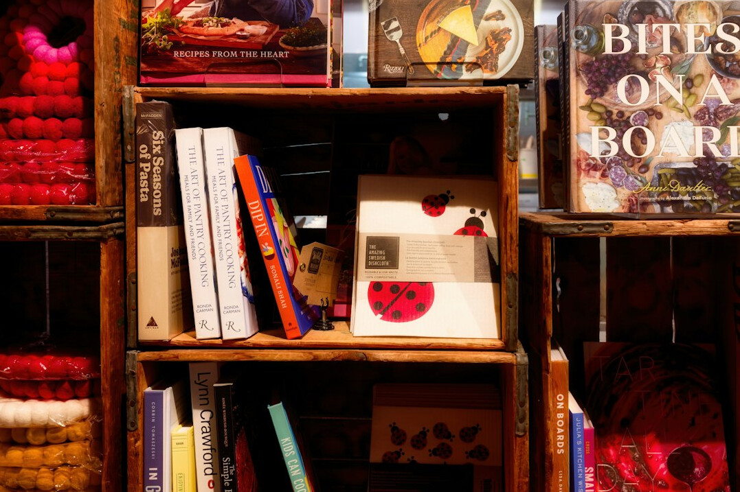 Books arranged on wooden shelves