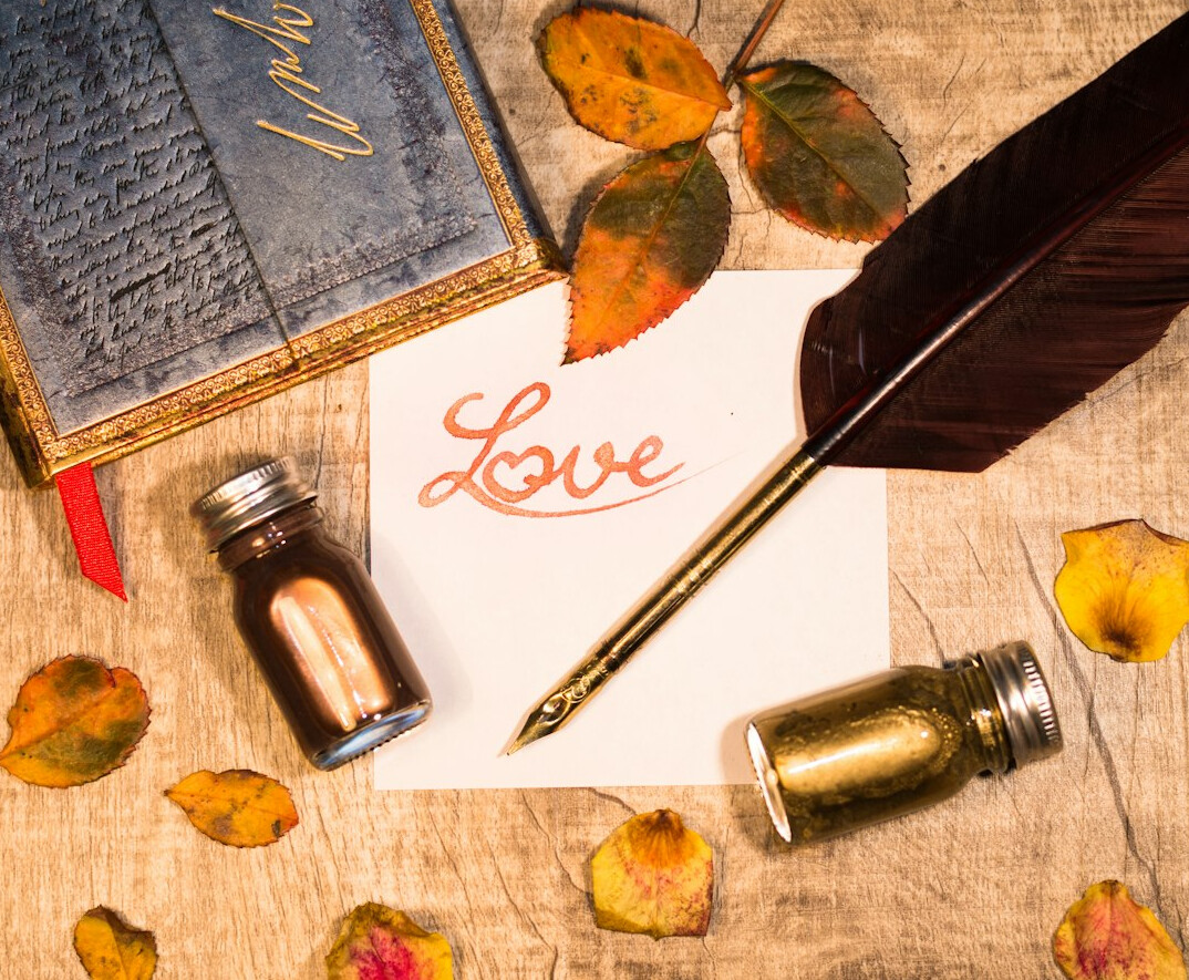 Handwritten old letters and a pen