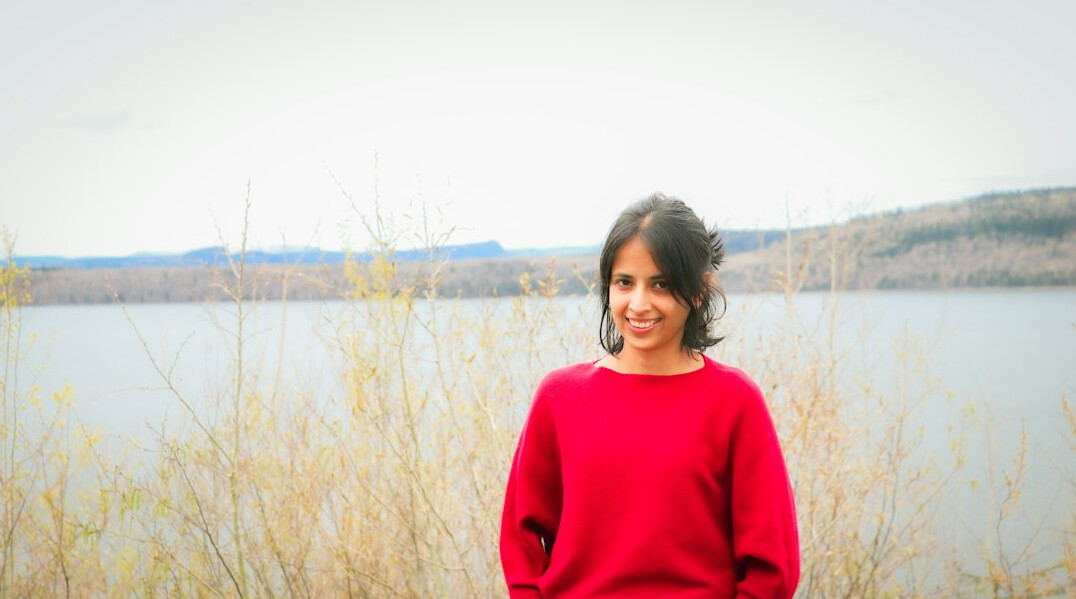 Portrait of a smiling Latin American woman editor